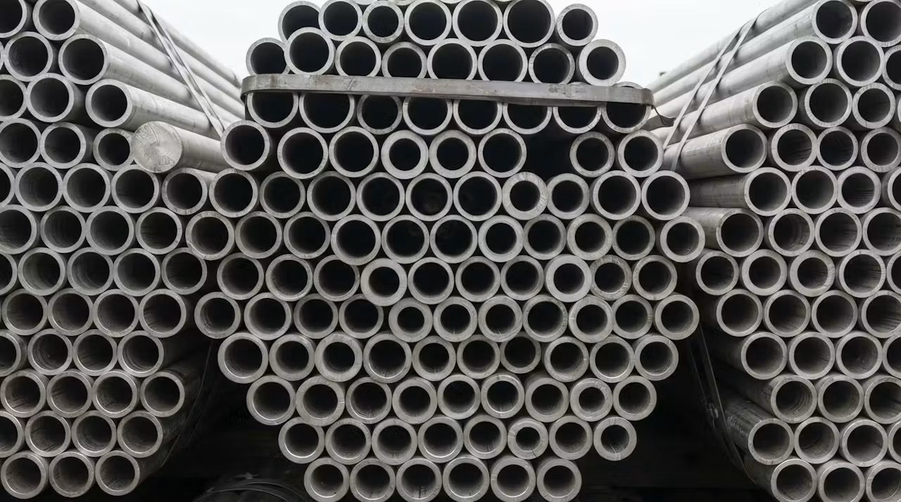 Cut ends of seamless alloy pipe, bore and wall thickness visible